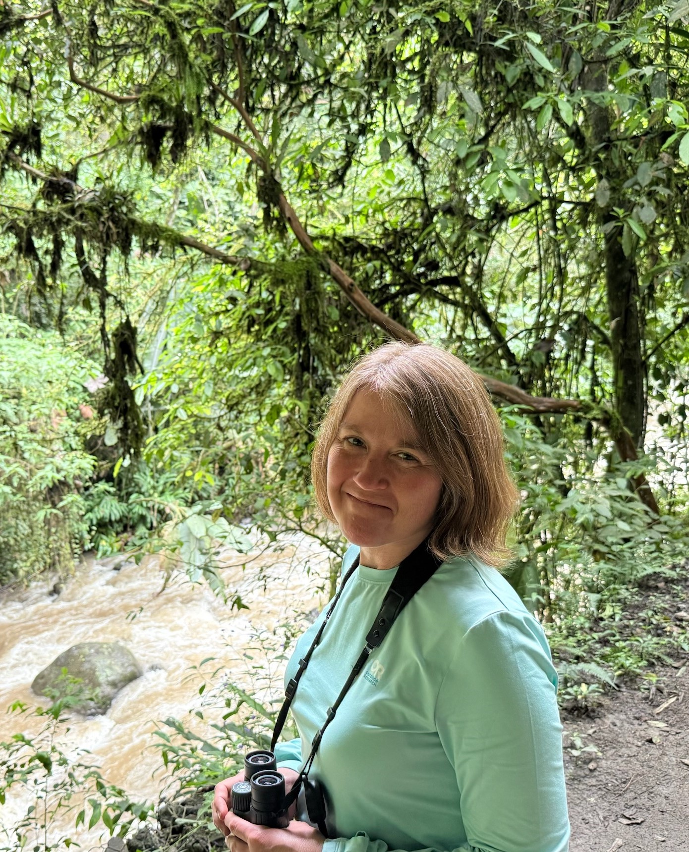 Andrea by a river
