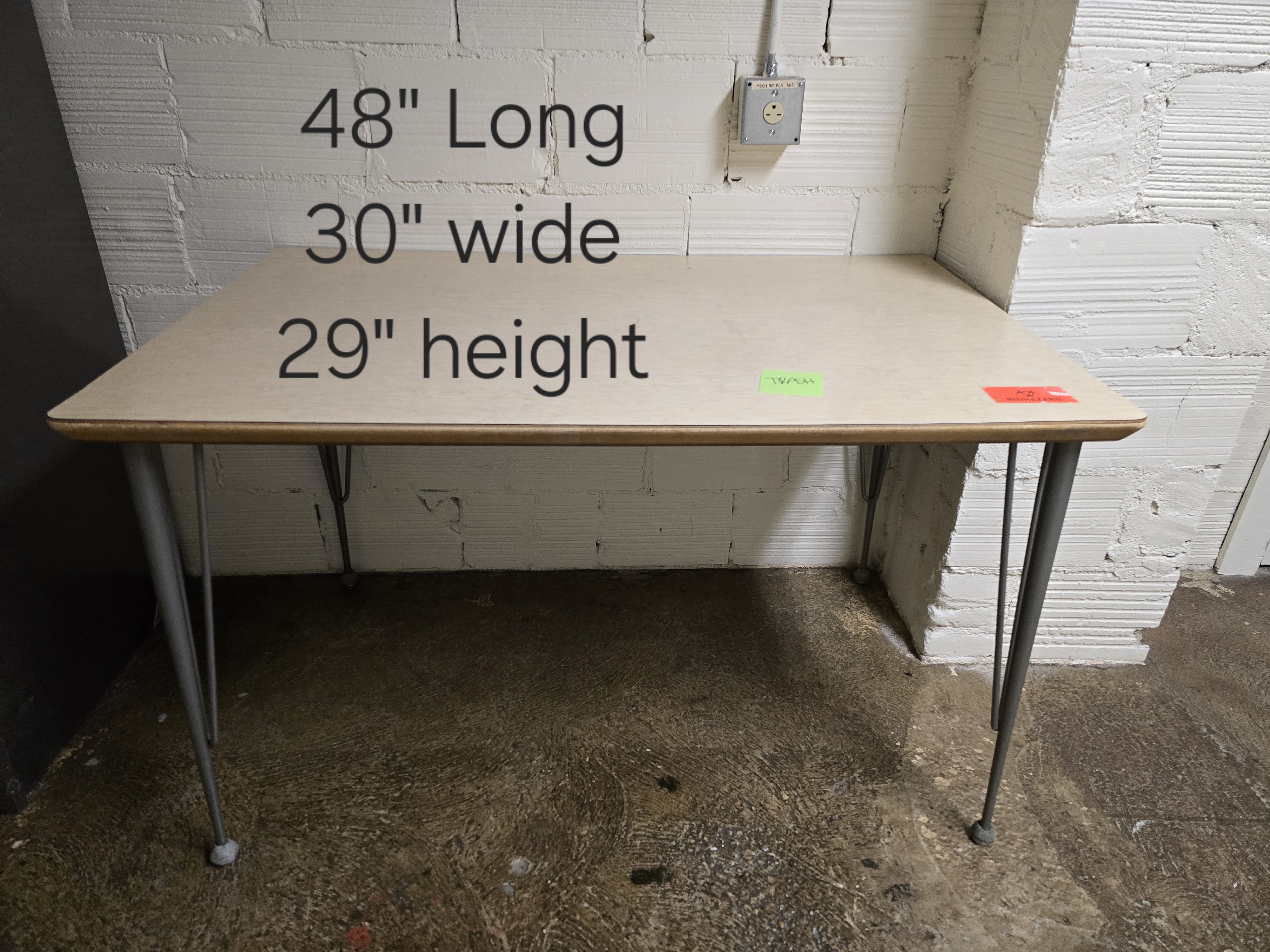 Wooden table with metal legs