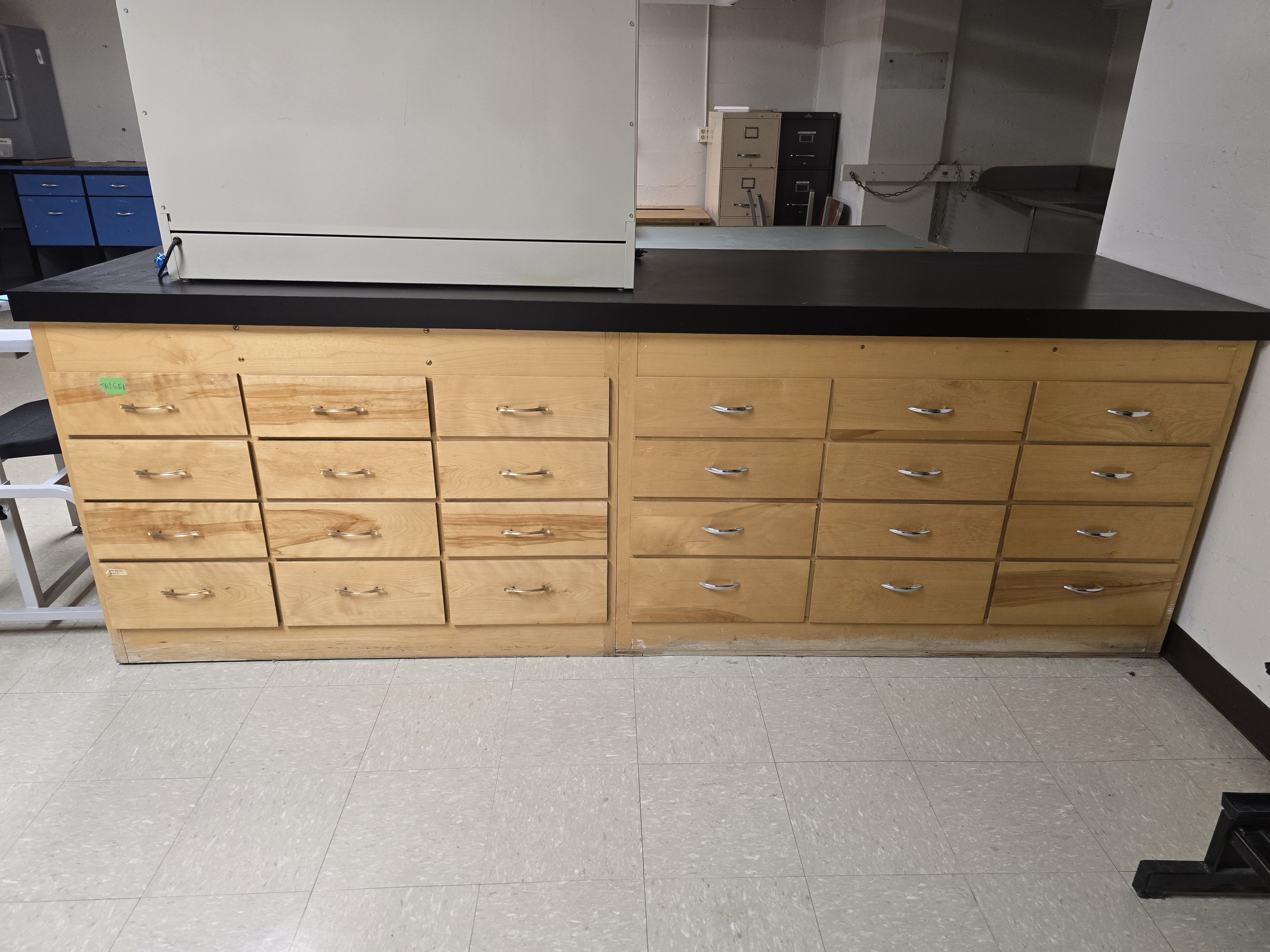 Long wooden table with cabinet storage below