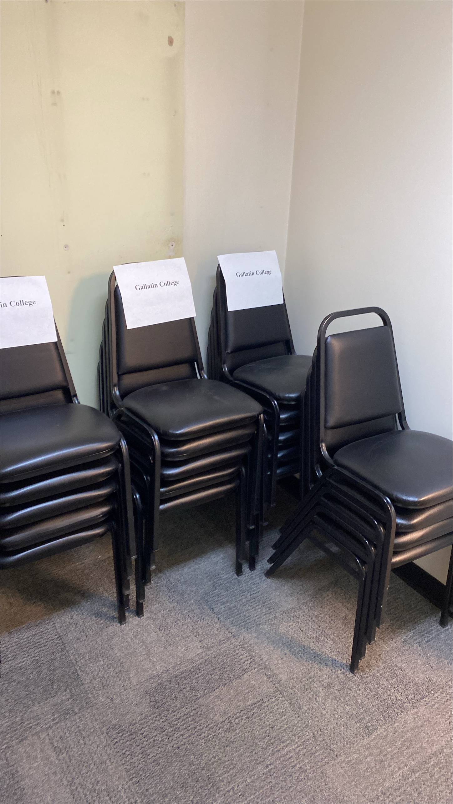 stackable chairs- vinyl seats and metal tubing construction