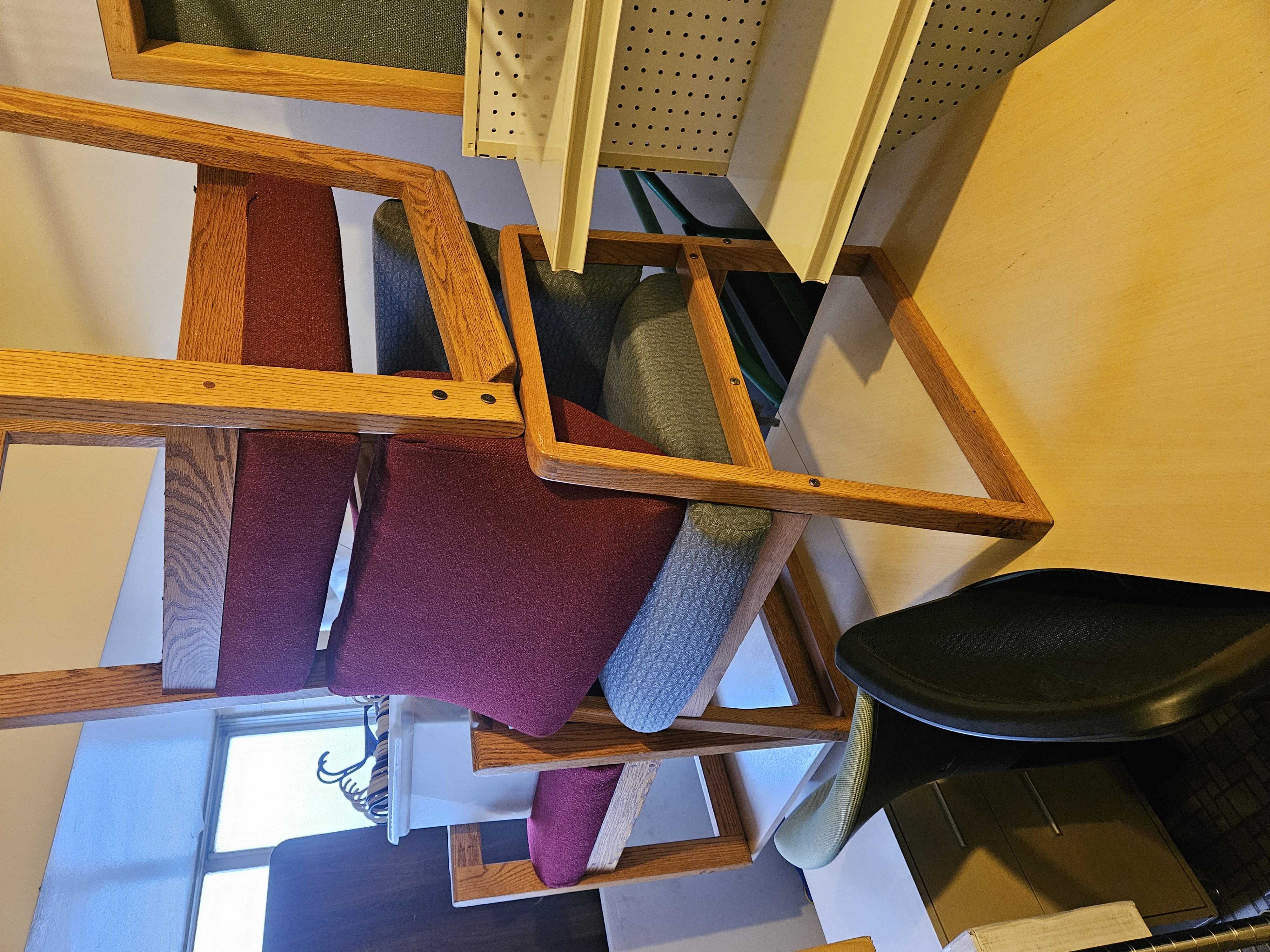 Office chairs stacked on a desk Stationary chairs stacked on one another