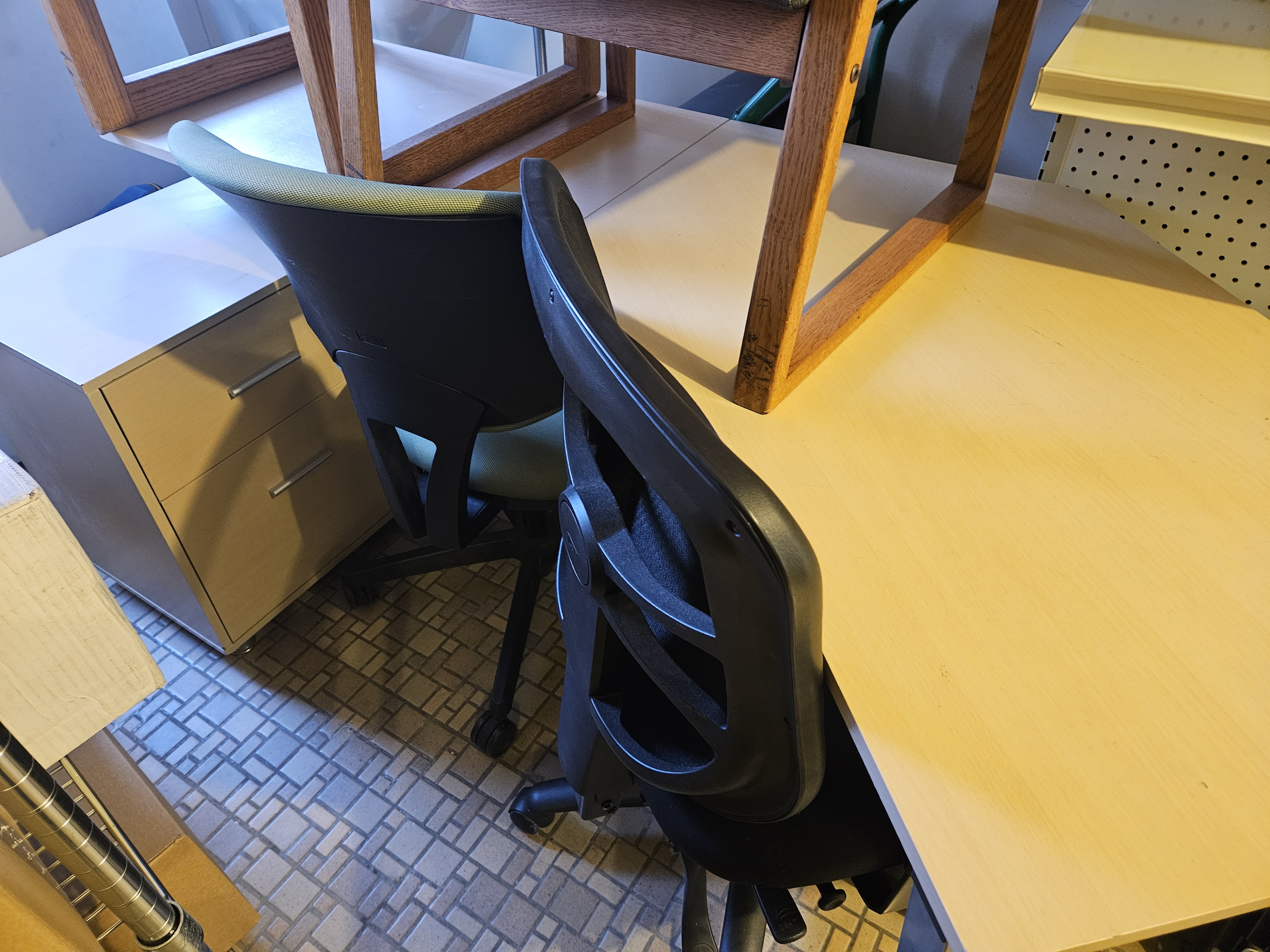 Office chairs on wheels Two rolling office chairs