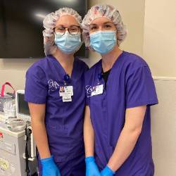 Two students attend a c-section