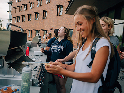 Students cook outside Yellowstone Hall.
