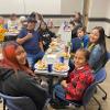 Students enjoying Thanksmas food