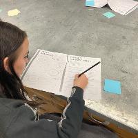 A participant brainstorms copy for the specimen print. 