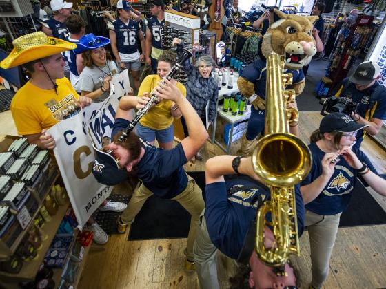 marching band performing in a local shop