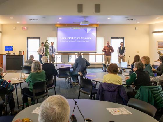 A group of people presenting in a large conference room | MSU Photo by Marcus "Doc" Cravens