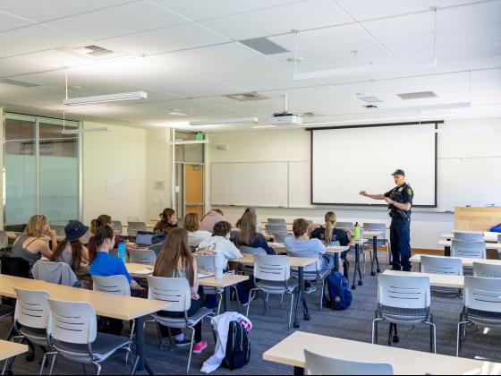 A police officer speaking to a group of high school students in a classroom |  MSU photo by Marcus "Doc" Cravens