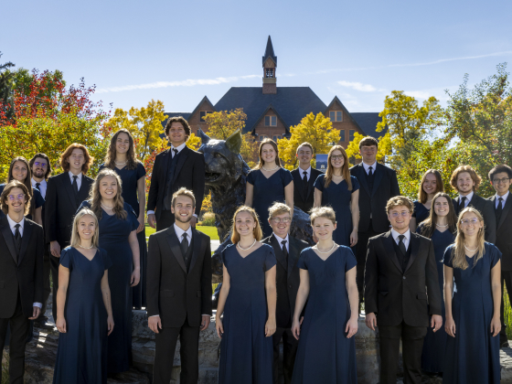 A group of MSU students dressed in formal attire pose for a photo. | 