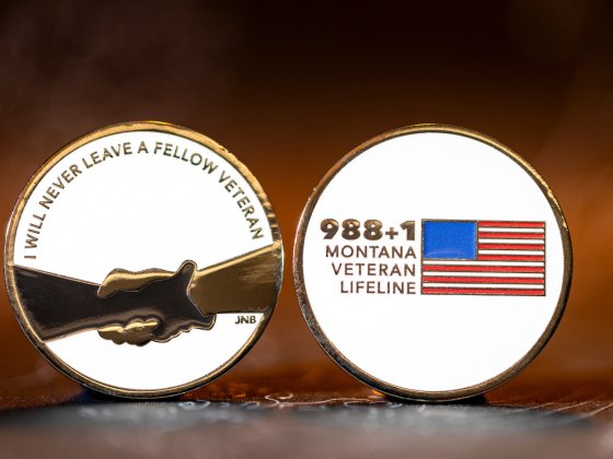 The front and back side of the 988 Project coin | MSU photo by Marcus "Doc" Cravens