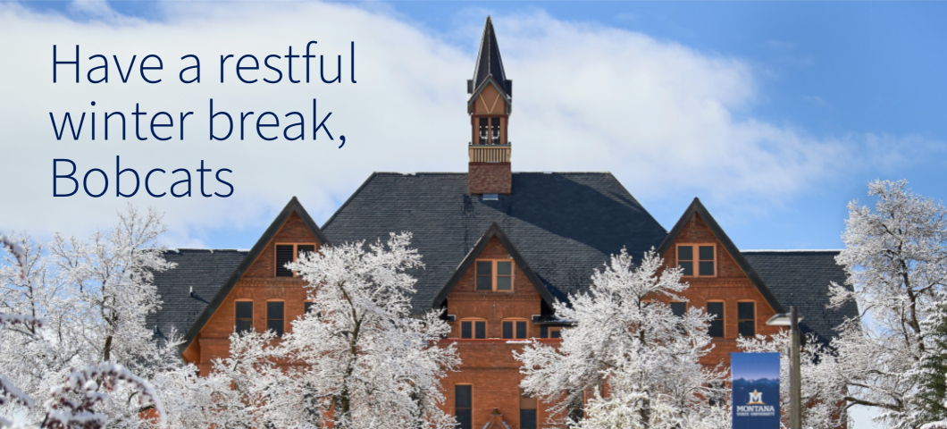 Montana State University's historic brick building framed by snow-covered trees under a clear blue sky, with the text overlay: 'Have a restful winter break, Bobcats.' | MSU