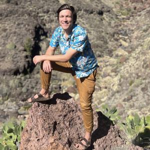 Zack Burton standing on a rock in Gran Canaria.