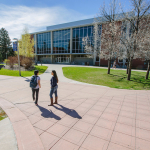 People walking past the MSU library