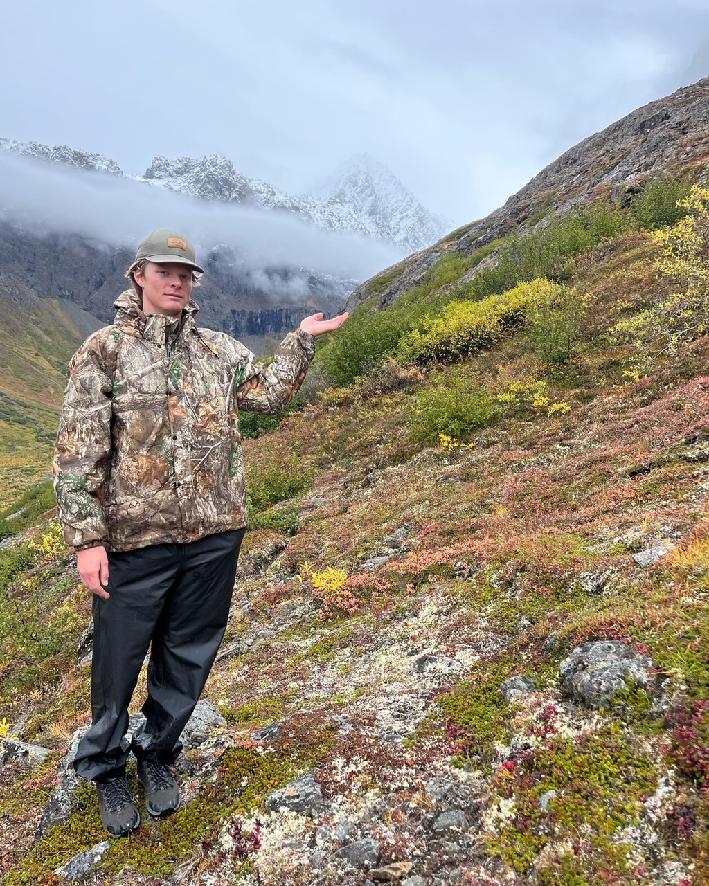 Picture of Will in the mountains, holding clouds