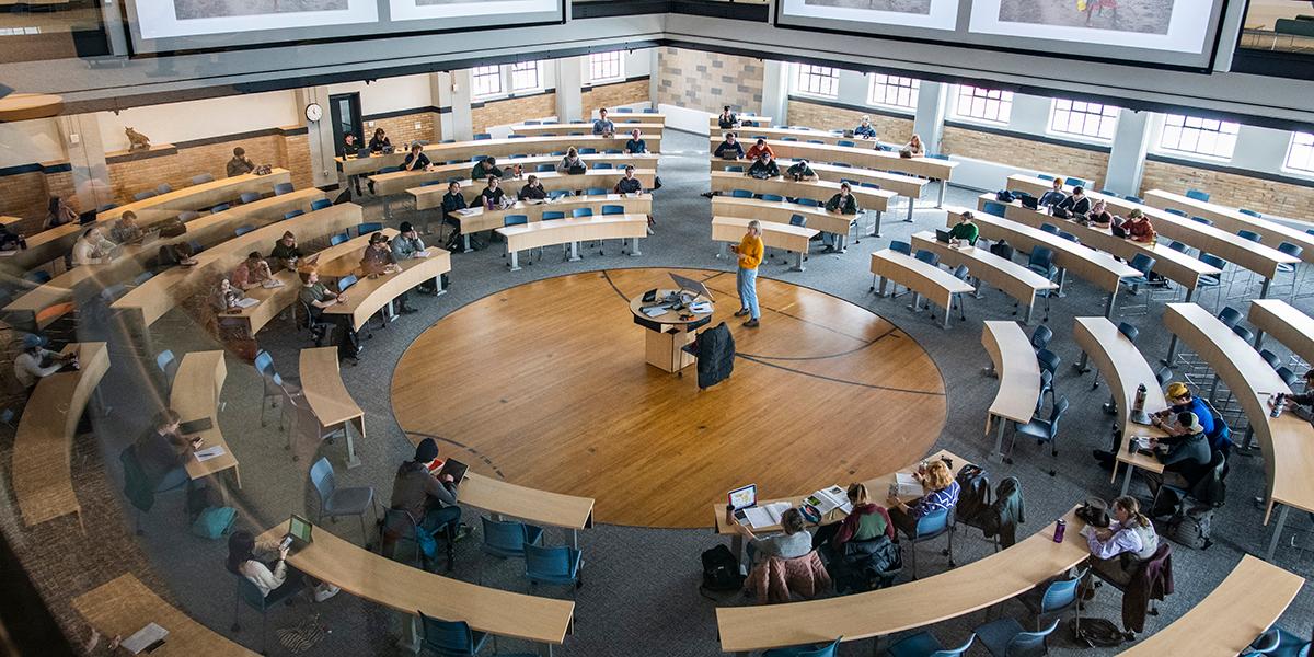 Circular classroom with an instructor in the center