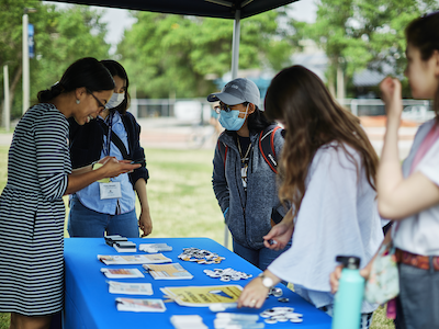 BIPOC members talk with stduents on campus during a meet and greet.