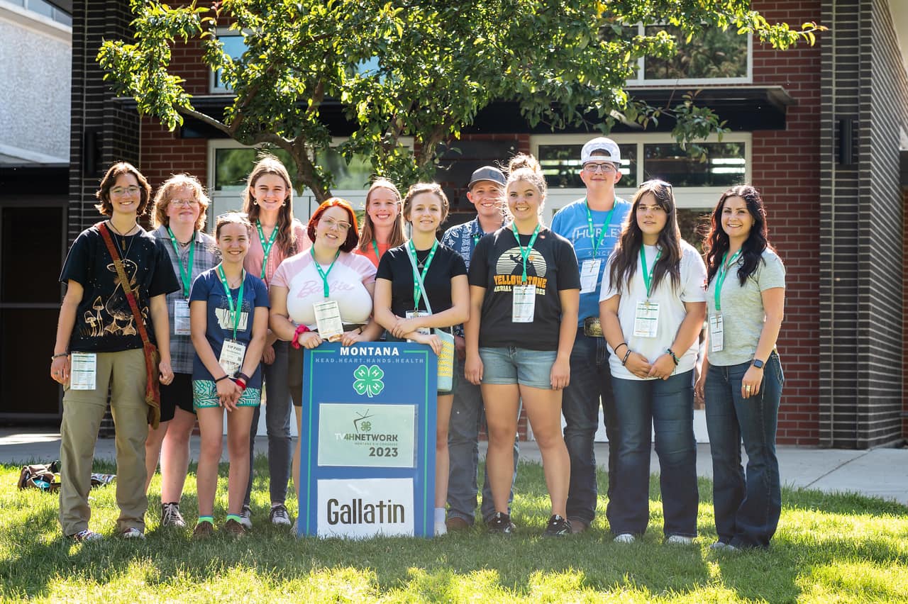 A group of 4-H youth members pose on the MSU campus