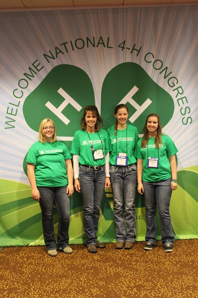 Kids in front of 4-H banner