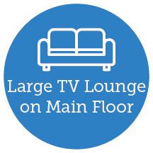 Large main floor lounge with big screen TV