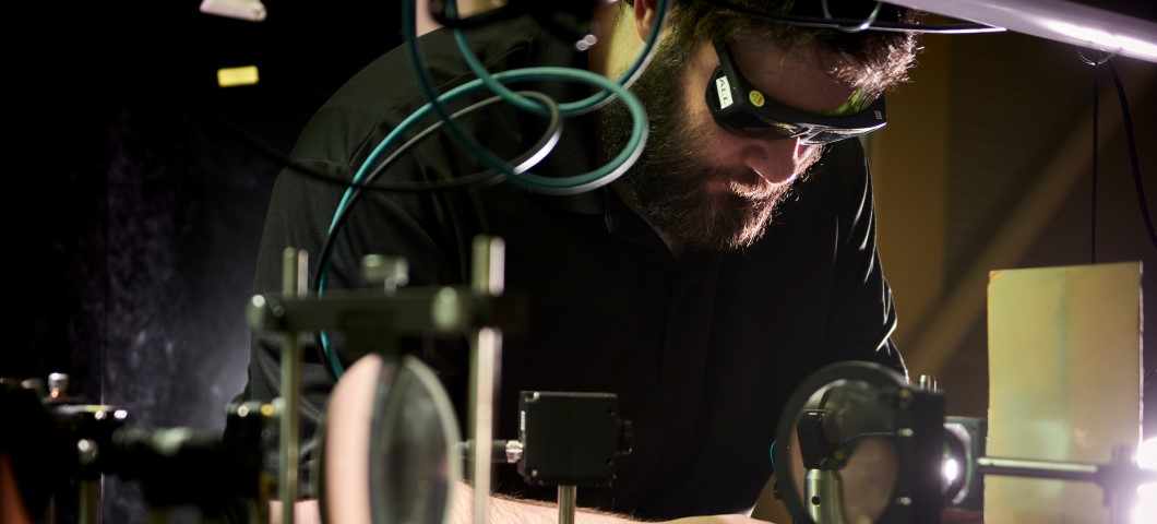 Student in protective glasses working in Spectrum Lab