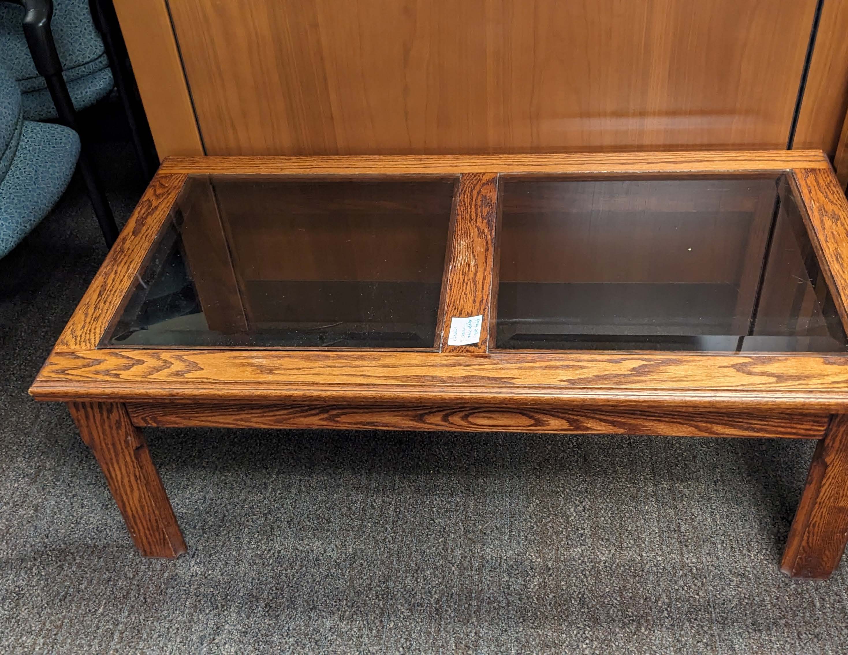 Wooden coffee table with glass top inlay