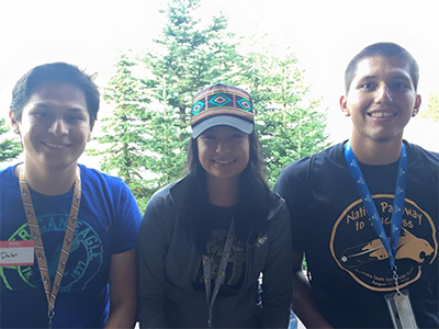 Three students posing for a group photo